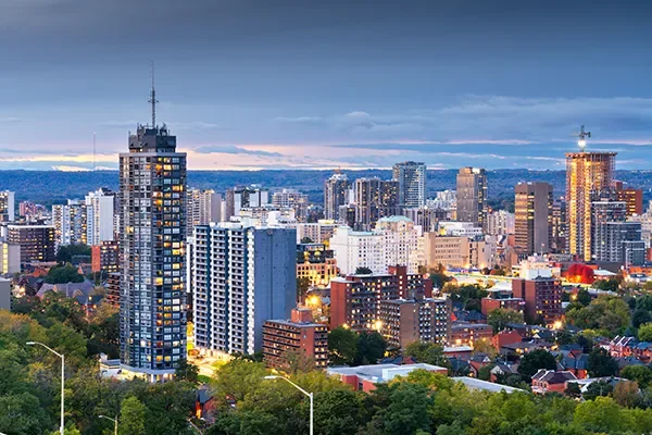 Hamilton, Ontario skyline at dusk with downtown towers and residential neighbourhoods